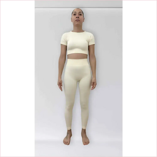 Cream-colored bubble gum top and matching bra top in stretchy fabric perfect for workouts