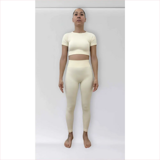Cream-colored bubble gum top and matching bra top in stretchy fabric perfect for workouts