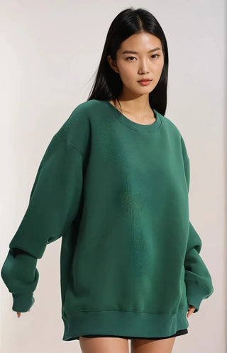 Felpa oversize verde con maniche lunghe e collo a girocollo.