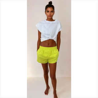 Shorts da corsa United in cotone giallo neon con elastico e laccio